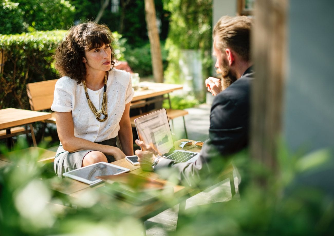 Two managers having a meeting outside