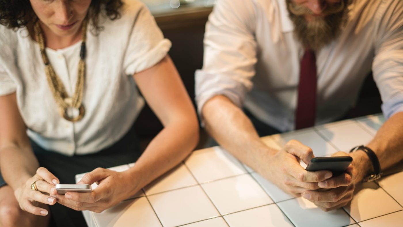 Two people struggling to break the ice in a one-on-one meeting